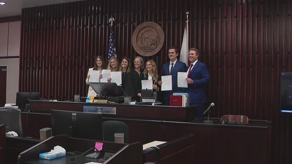 Judge swears in daughter, fellow graduates