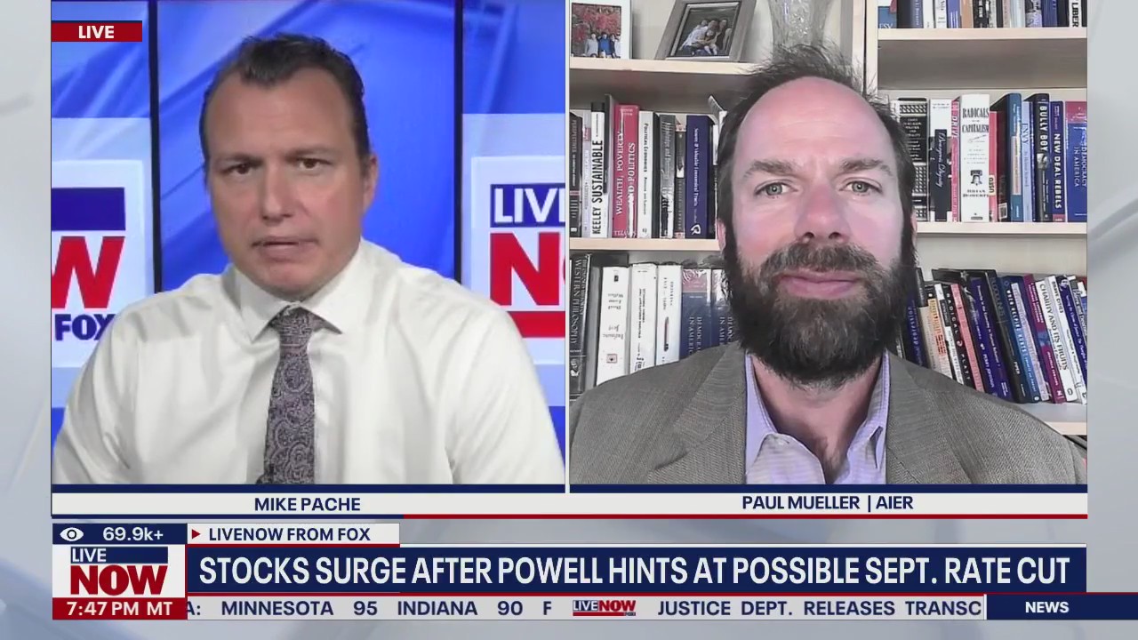 Stocks surge after Powell hints at possible rate cut