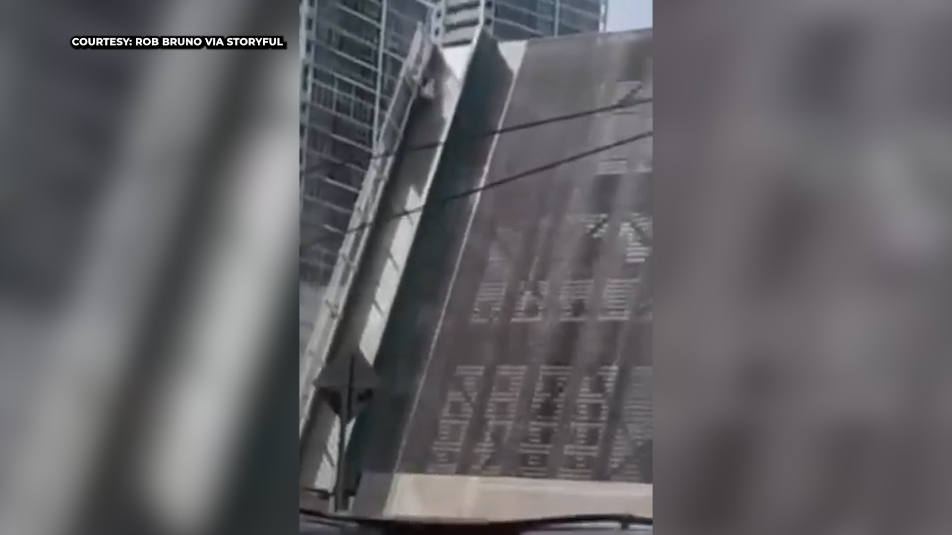 Woman falls from rising drawbridge in shocking video