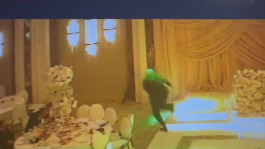 Wedding crasher seen stealing box of money