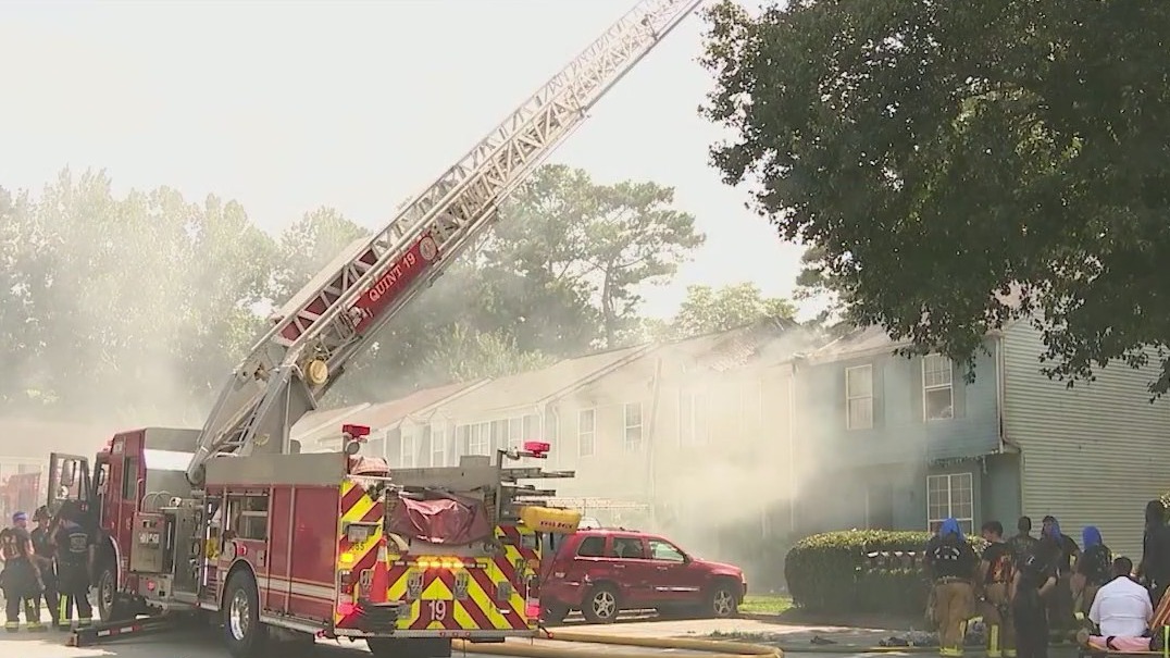 Four firefighters hurt in townhomes fire