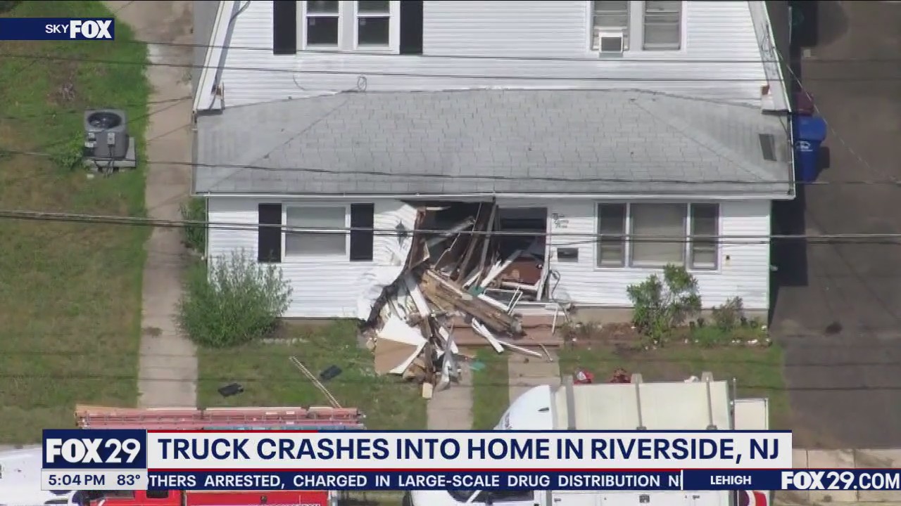 Truck crashes into home in Riverside