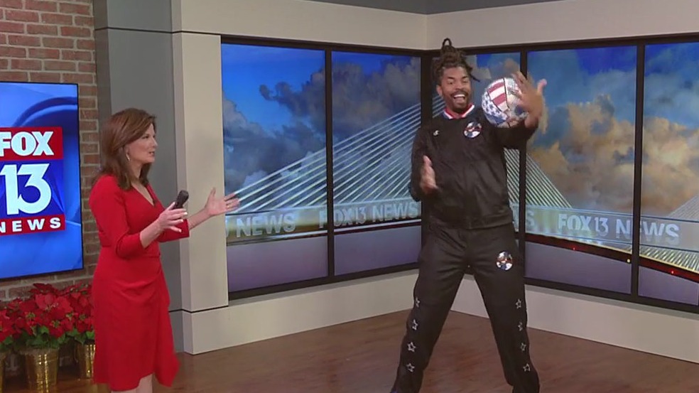 Harlem Globetrotter visits FOX 13 studio