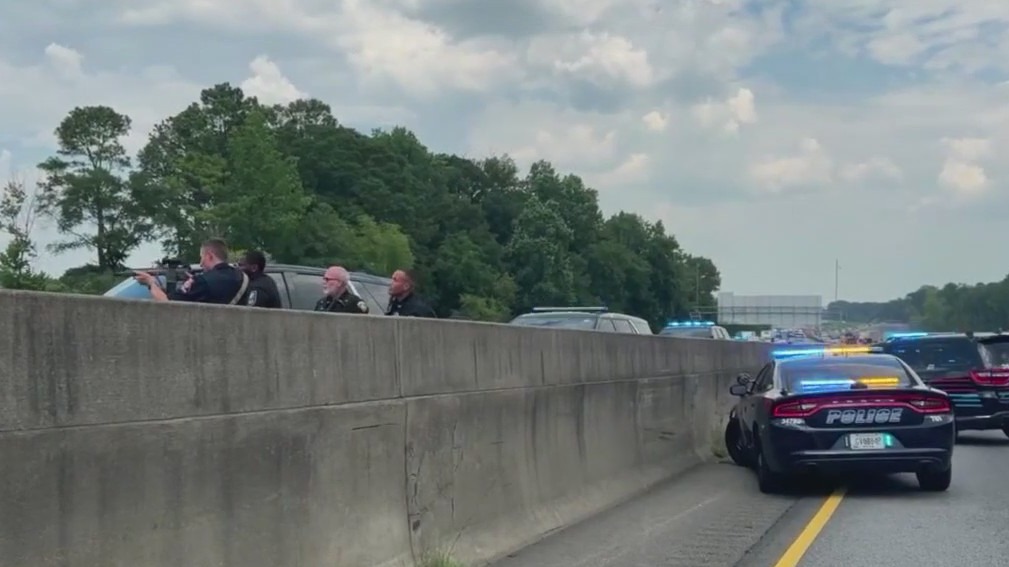 Suspected arrested after shooting at police, chase down highway