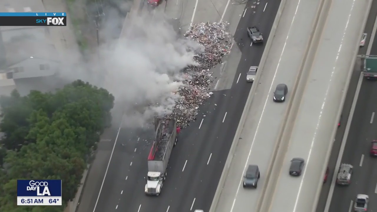 Garbage truck crashes, catches fire on 5 Freeway