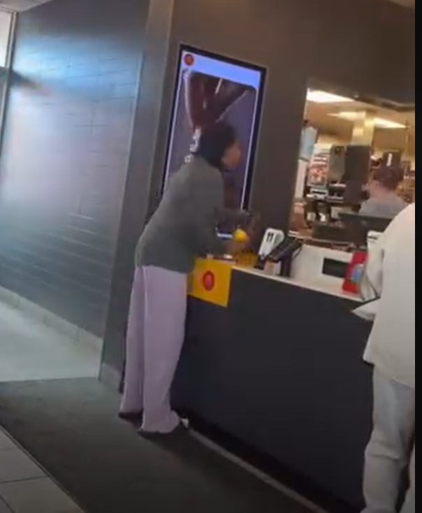 Woman caught on camera throwing hot coffee on McDonald's manager
