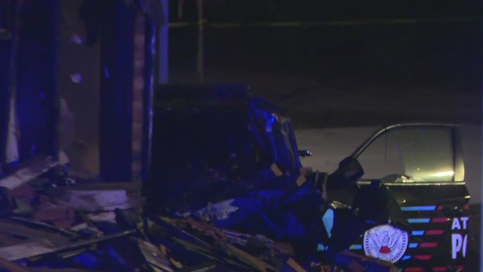 Atlanta officer critical after smashing into home