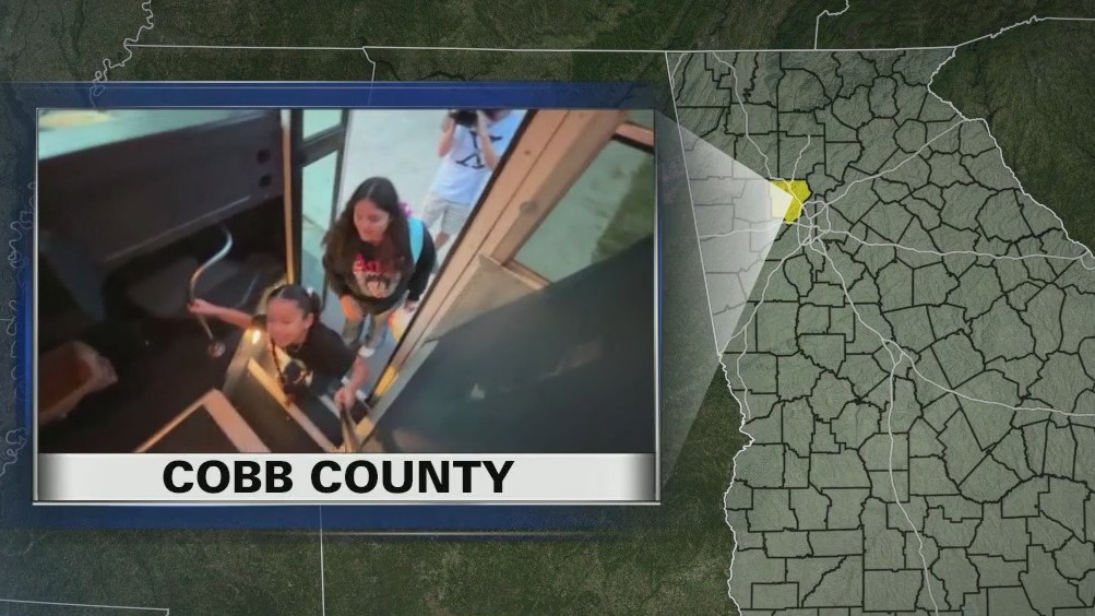 Cobb County students practice riding bus