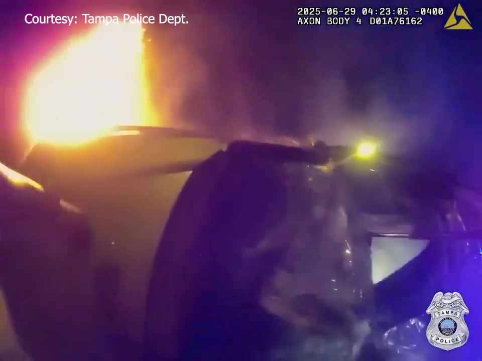 Tampa police officers save driver after fiery crash