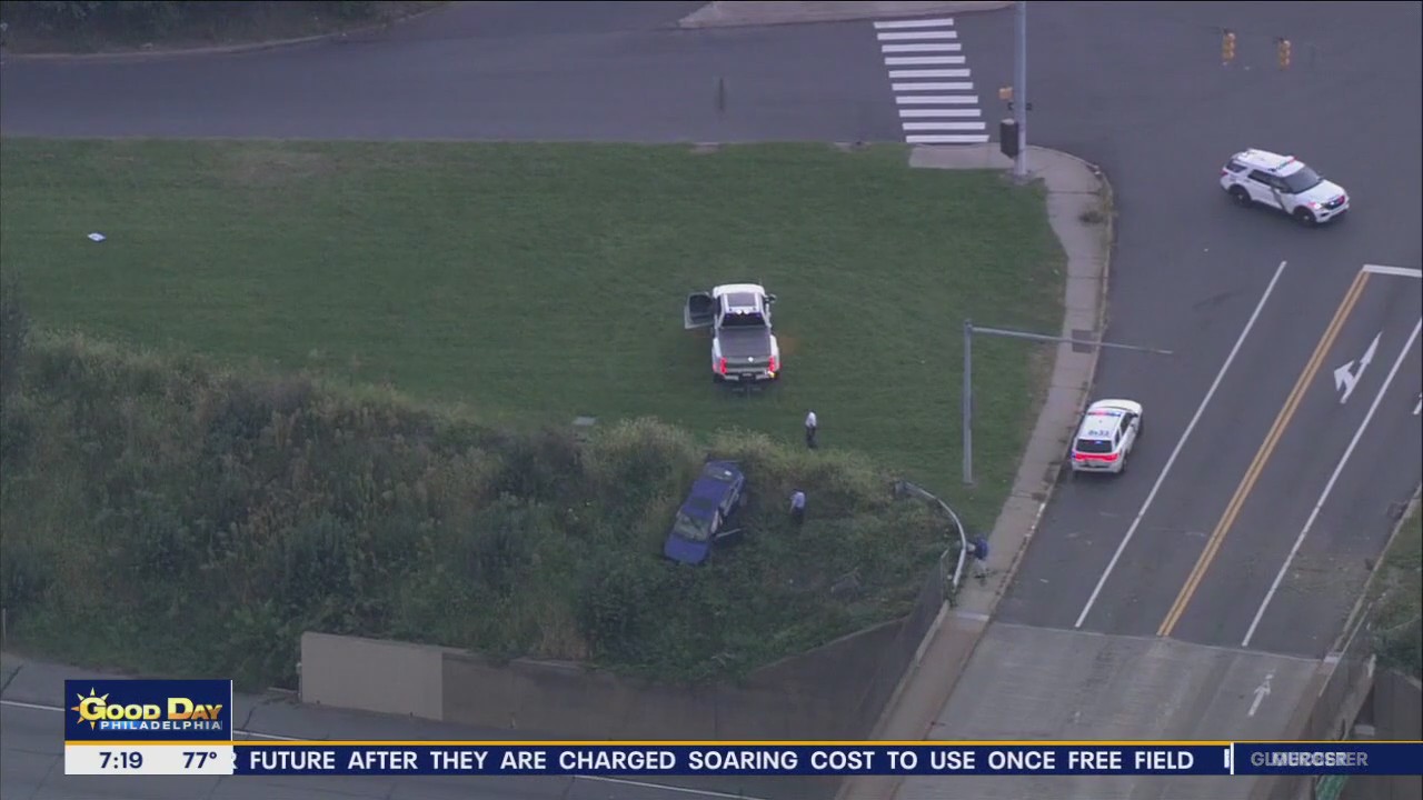Vehicle plunges down embankment, shuts down road in Northeast Philadelphia