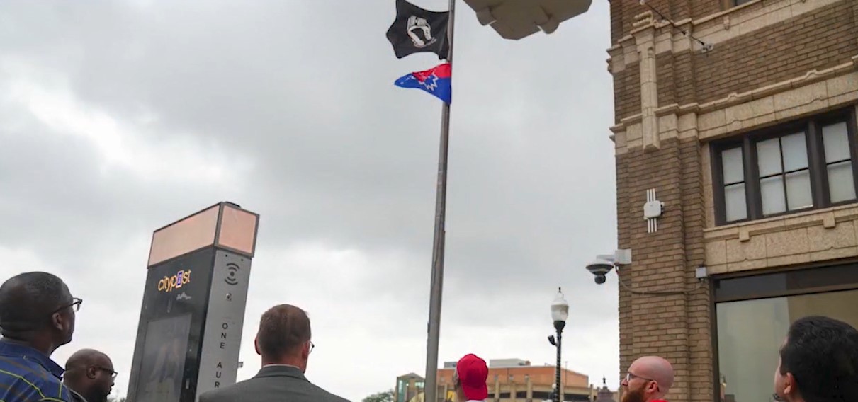 Aurora flag raising change sparks controversy