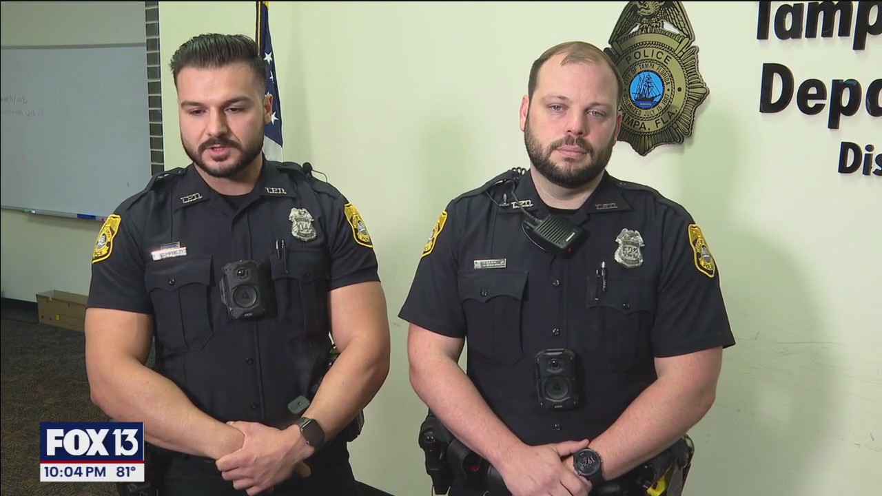 Officers save woman from burning car