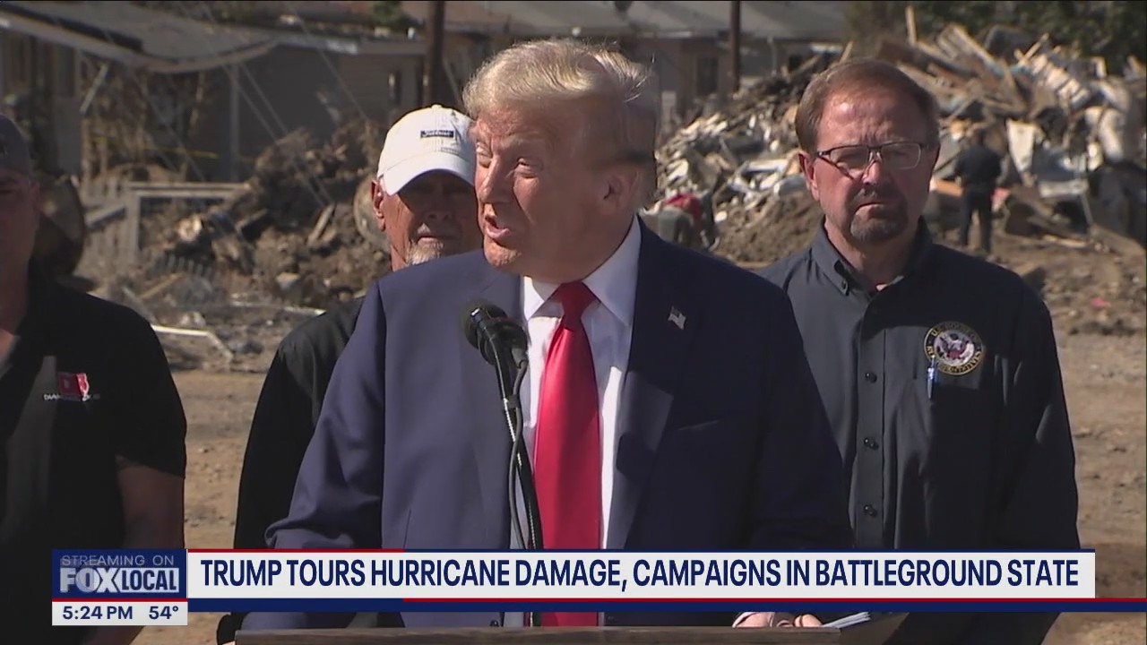 Trump tours hurricane damage as battleground race intensifies