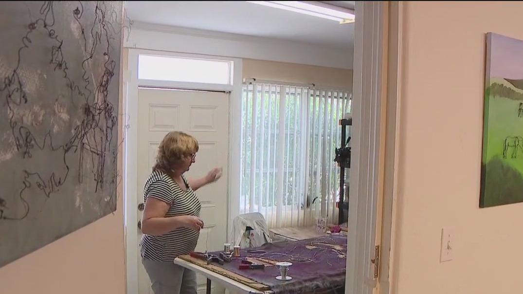 Mixed-media artist creating 3D artwork by hand