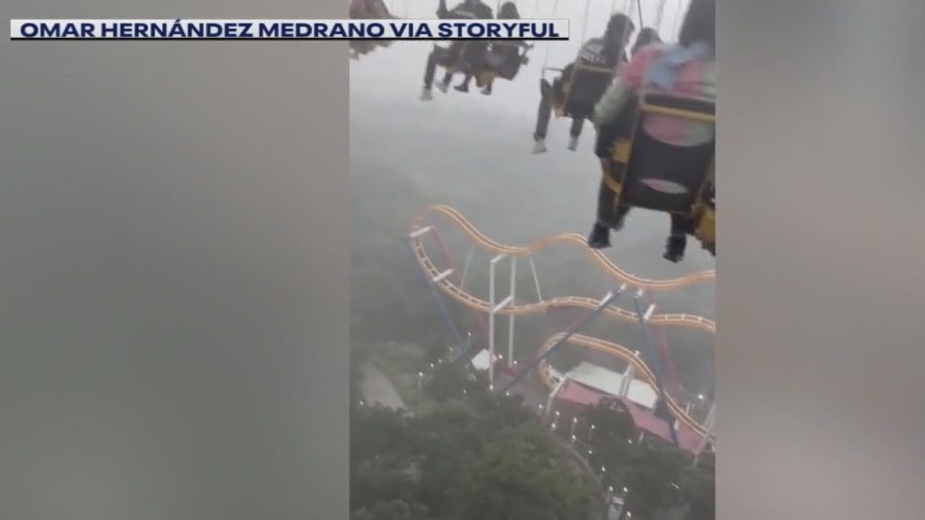 Riders left dangling above amusement park as storm hits